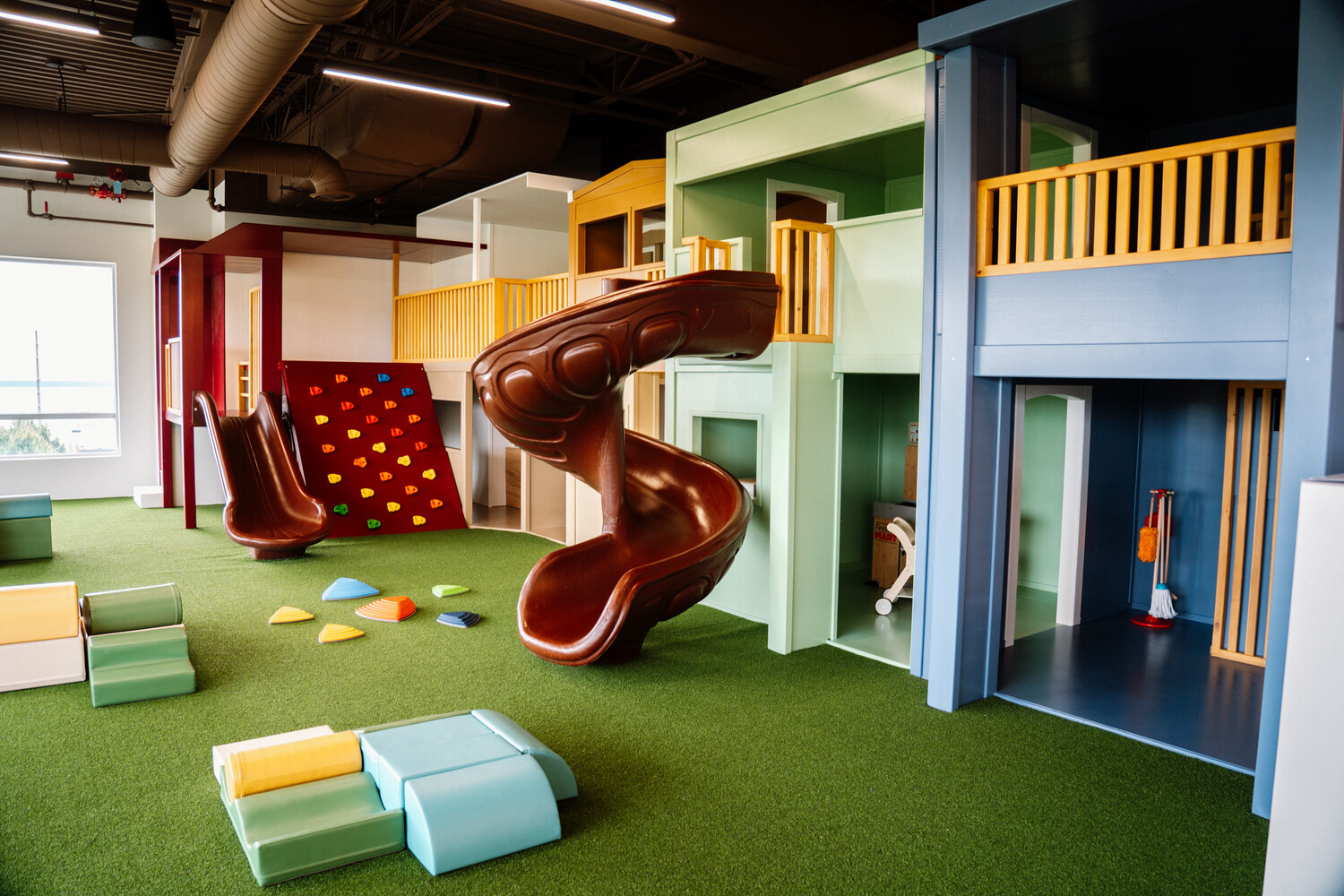 Light wood toddler soft play structure on cream mats