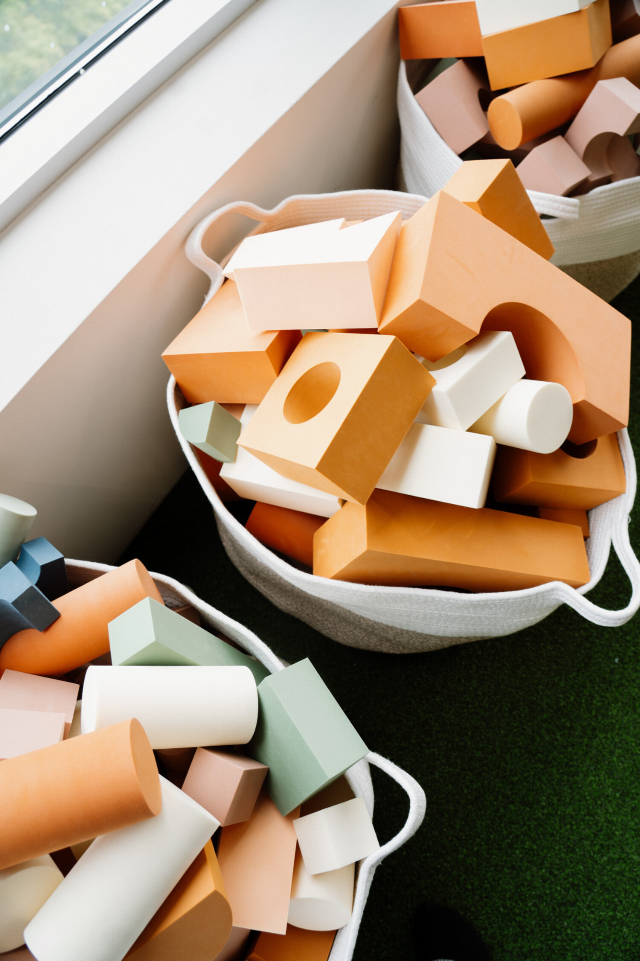 Baskets of soft wooden building blocks