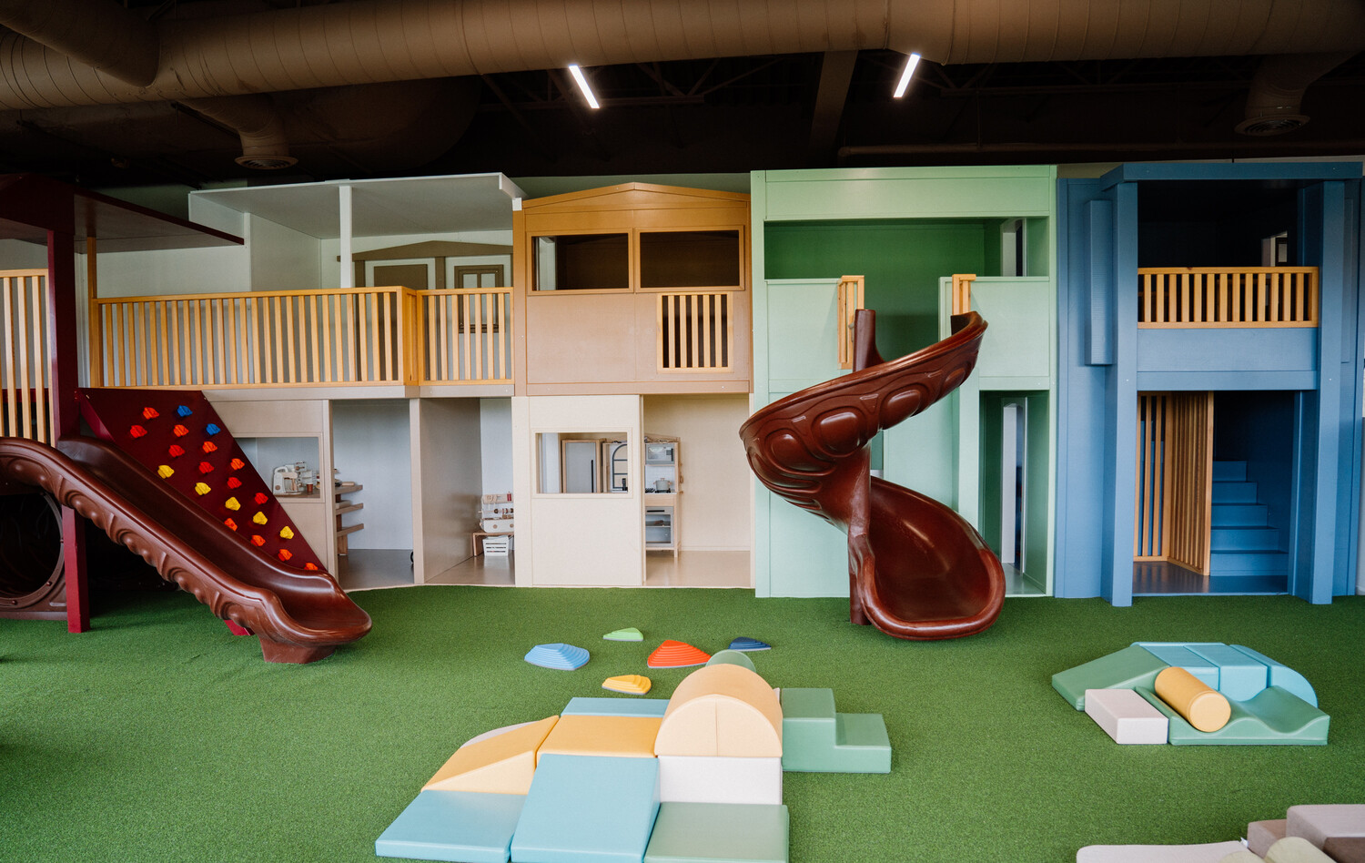 Wooden toddler playhouses in the play area